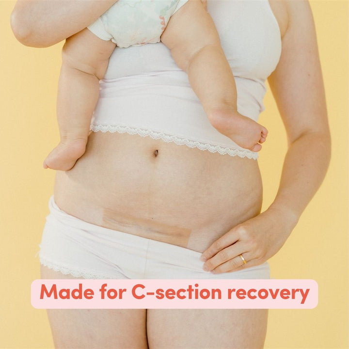 Female wearing white underwear and underwear set applying a c-section scar patch with text saying'Made for C-section recovery' on a yellow background.