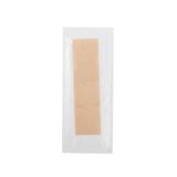 Beige c-section scar patch in a clear plastic packaging on a white background