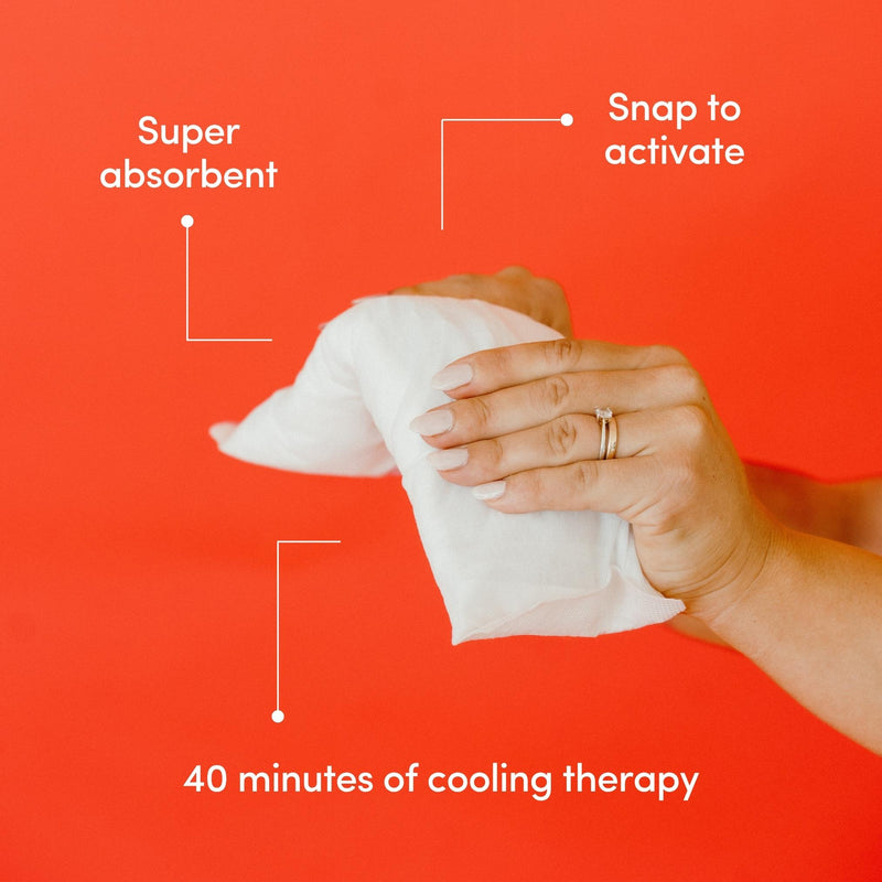 A womans hand holding a white instant ice maxi pad with text on a red background highlighting its benefits