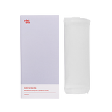 An unpackaged instant ice maxi pad, next to its box with a clear background