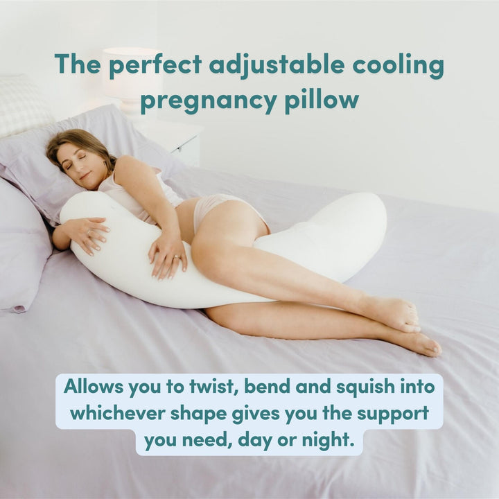 Woman lying on a bed with an adjustable cooling pregnancy pillow with text overlay saying 'The perfect adjustable cooling pregnancy pillow' and 'Allows you to twist, bend and squish into whichever shape gives you the support you need, day or night.'