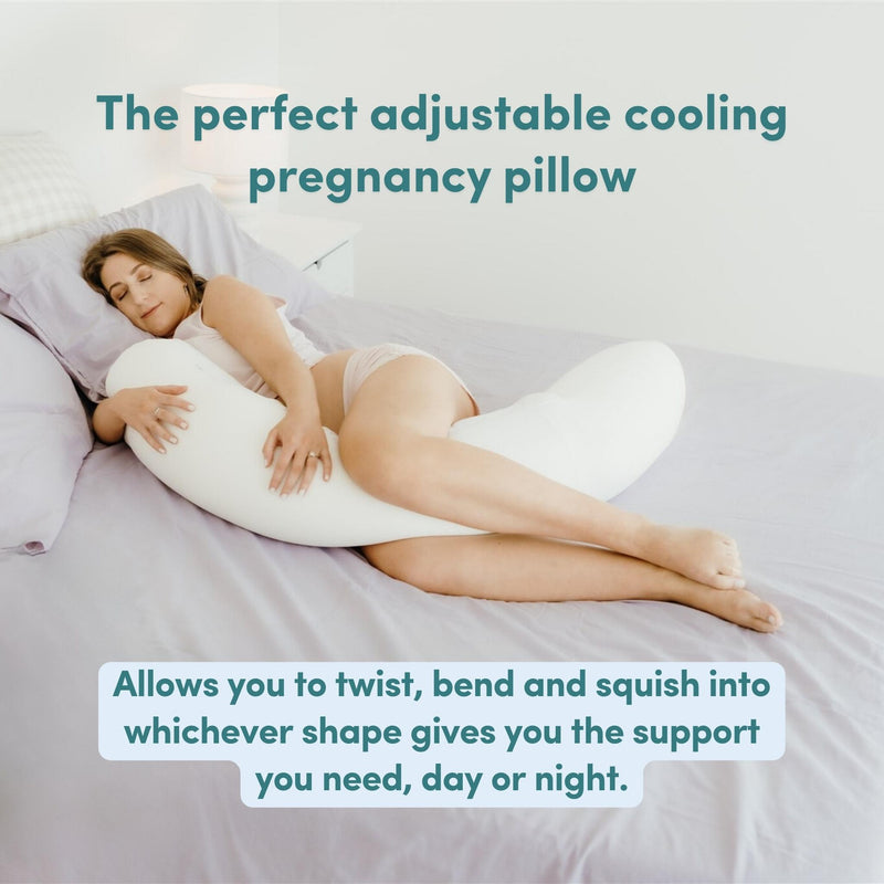 Woman lying on a bed with an adjustable cooling pregnancy pillow with text overlay saying 'The perfect adjustable cooling pregnancy pillow' and 'Allows you to twist, bend and squish into whichever shape gives you the support you need, day or night.'