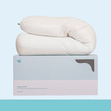 Pregnancy pillow on a branded box with a light blue background