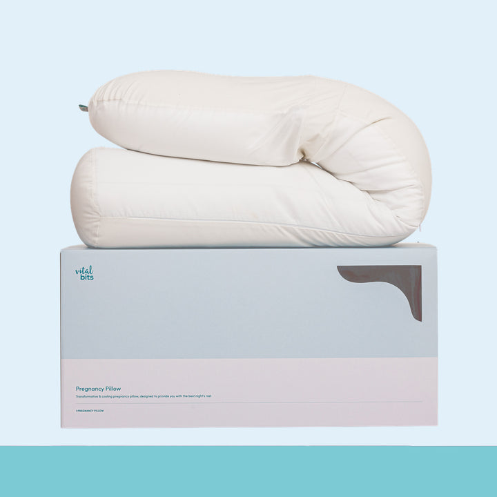 Pregnancy pillow on a branded box with a light blue background