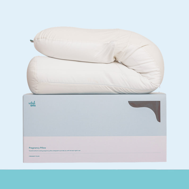 Pregnancy pillow on a branded box with a light blue background
