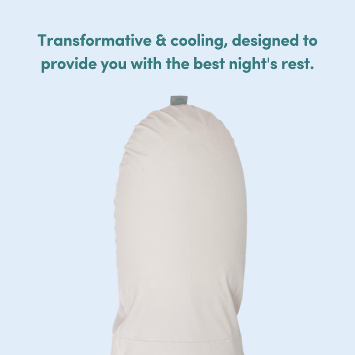 White pregnancy pillow on a light blue background with text highlighting its transformation and cooling features.