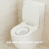 A Vital Bits Sitz Bath being used on a toilet in a bathroom setting