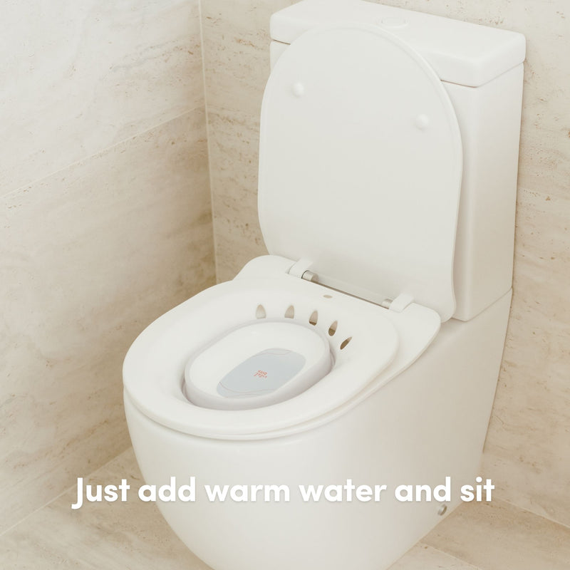 A Vital Bits Sitz Bath being used on a toilet in a bathroom setting