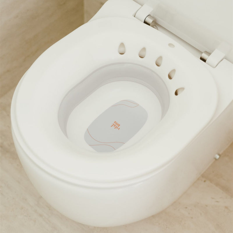 A Vital Bits Sitz Bath displayed on a toilet 
